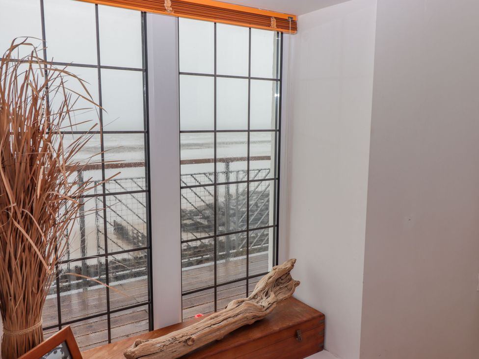 A view from a window with driftwood and a wooden box at Rock House in Narberth