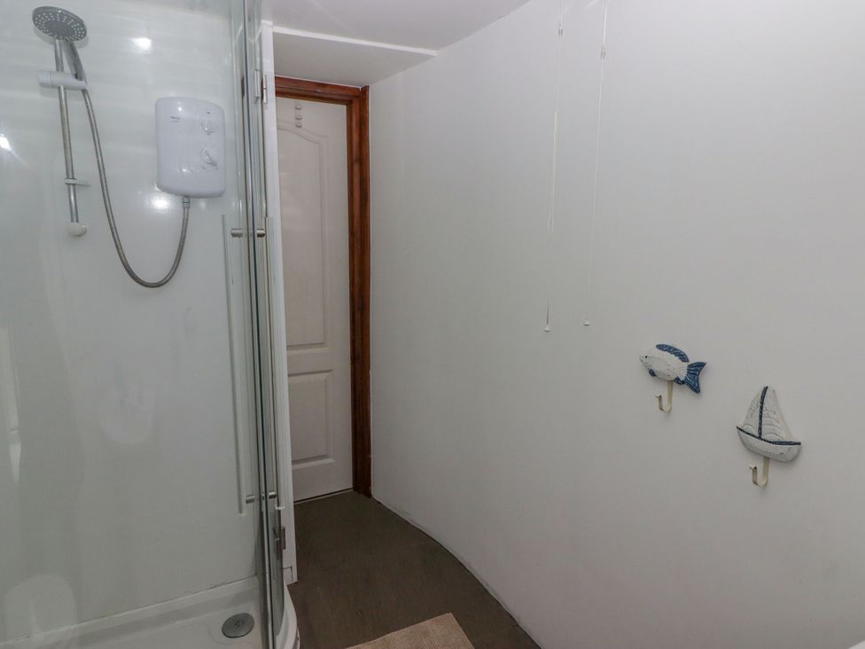 A bathroom with a shower and decor at Rock House in Narberth