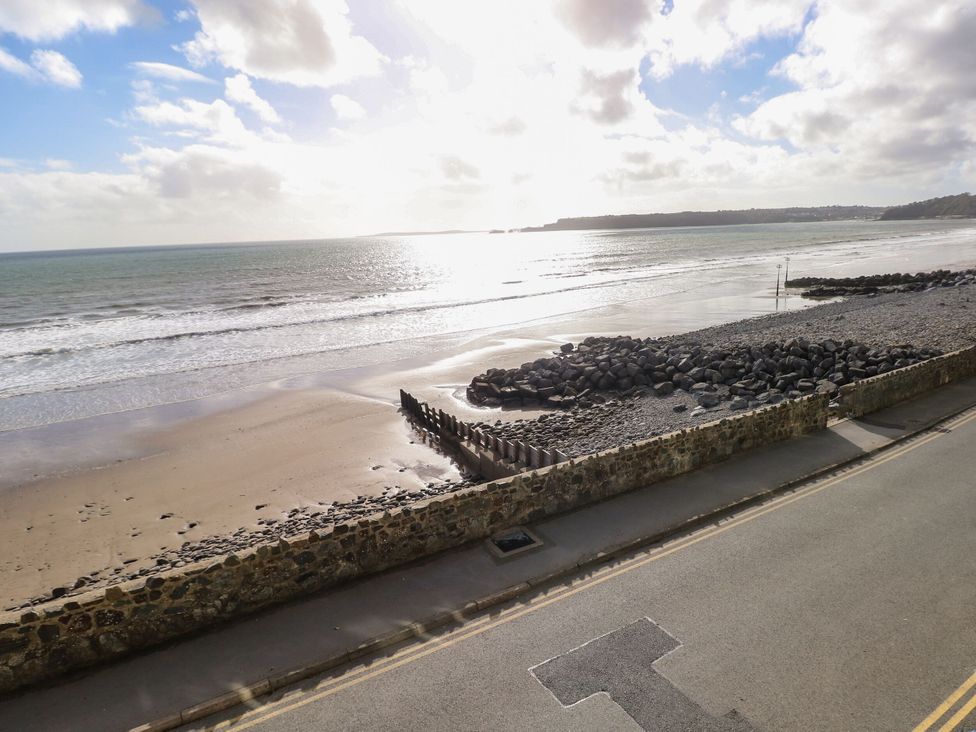 A beach with sand and waves at Rock House in Narberth