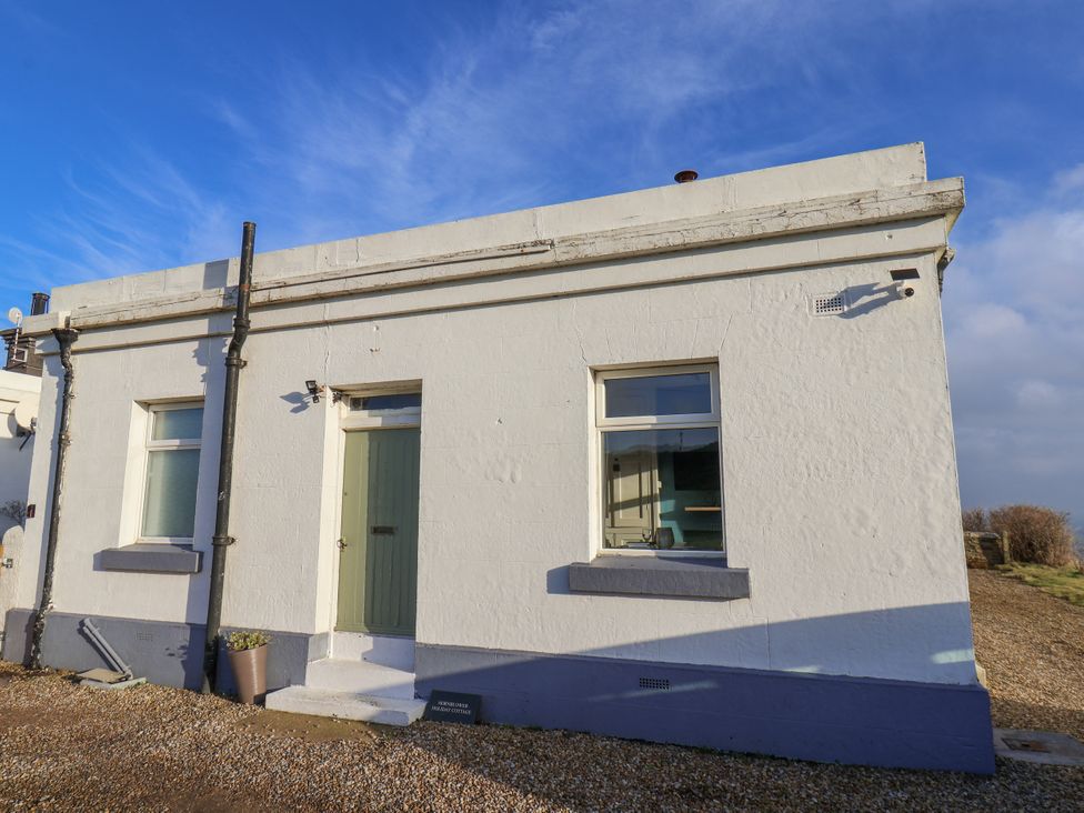 A building exterior with a door and windows at Hornblower Lodge in Whitby