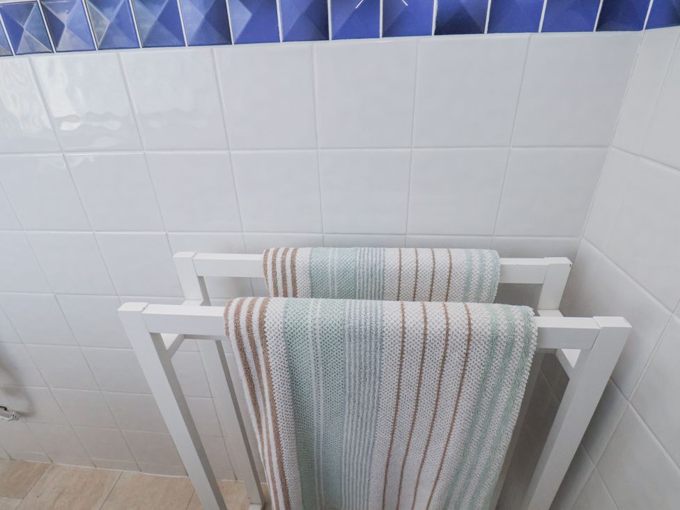 A towel rack with towels at Hornblower Lodge in Whitby