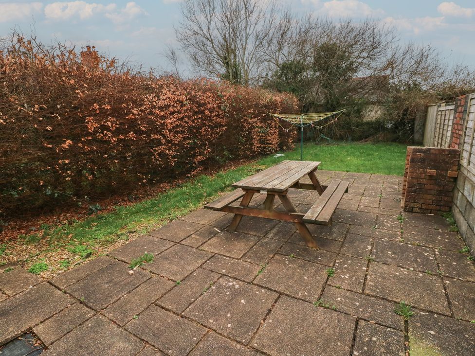 A garden with a picnic table and clothesline at Kenvor in Newport, Pembrokeshire