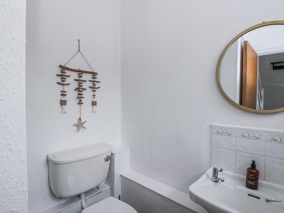 A bathroom with a toilet and sink at Sycamore near Killean Farmhouse Cottages Inveraray