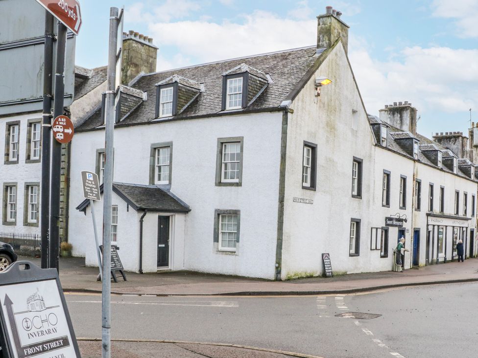 A building with street signs in front at Sycamore Killean Farmhouse Cottages near Inveraray