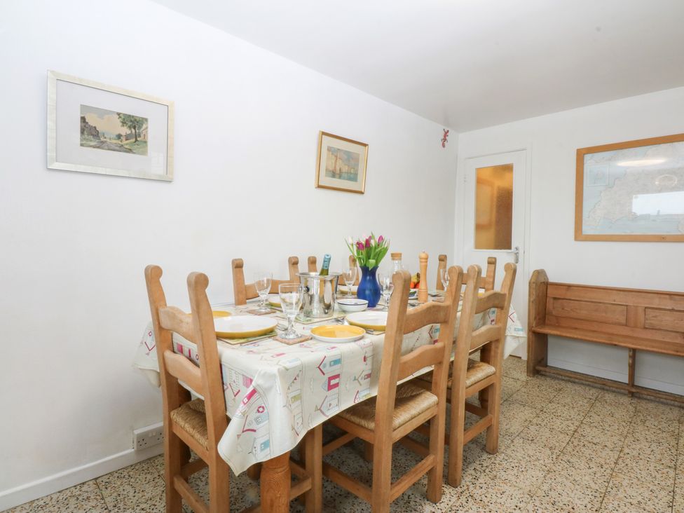 A dining room with a table set for dinner at Parc y Brenin Holidays, Abersoch