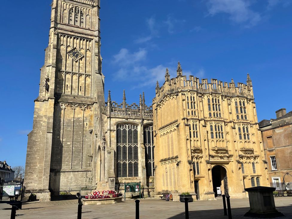 An outdoor view of a tower and building at Meadow Lodge in Cerney Wick near South Cerney, Cotswolds