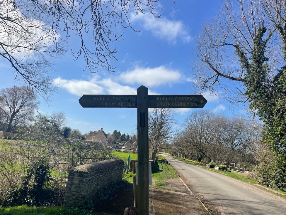 A signpost indicating footpaths to Cricklade and South Cerney near Cerney Wick