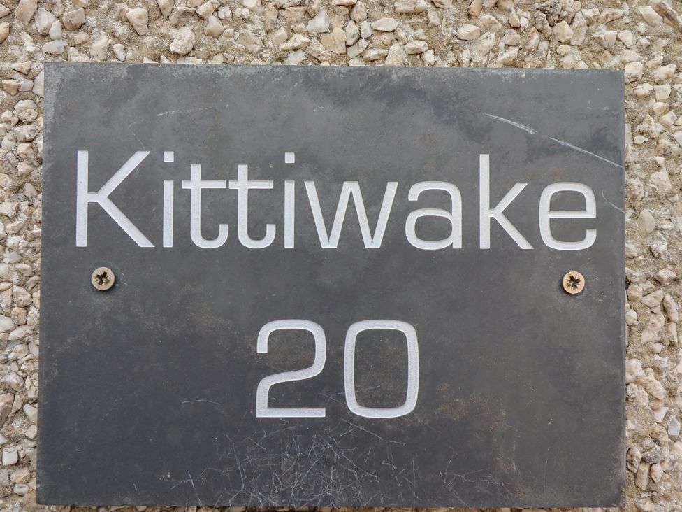 A nameplate with Kittiwake 20 on it at Kittiwake at No 20 Seahouses