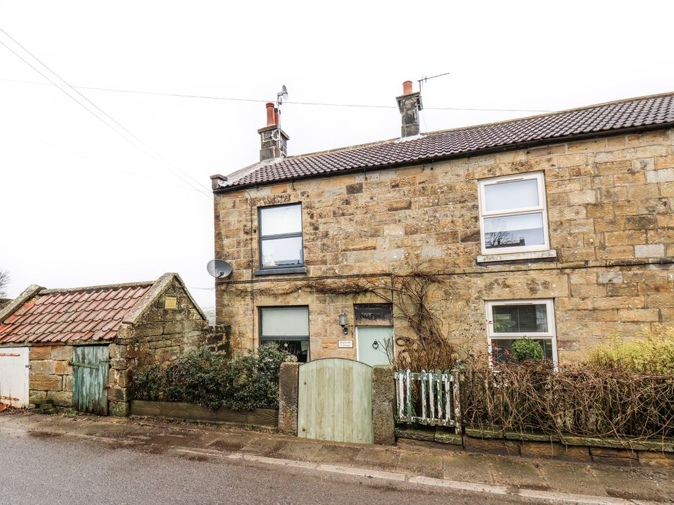 A house with a door and windows at Ingleside Cottage in Whitby