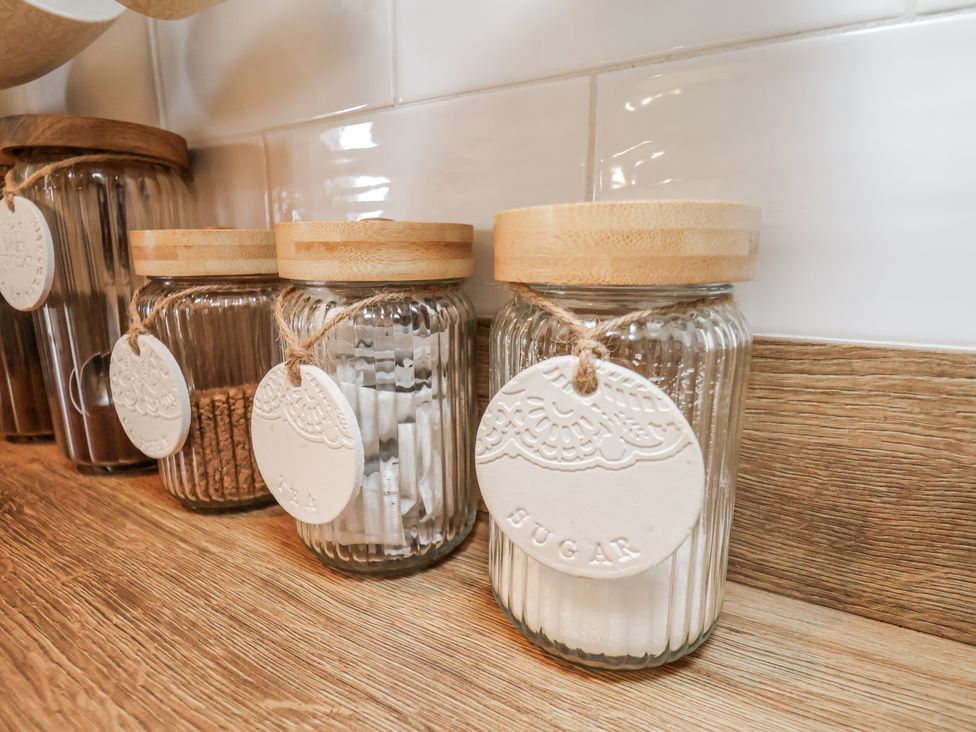 Glass jars with wooden lids for sugar and sweeteners at Ingleside Cottage Whitby