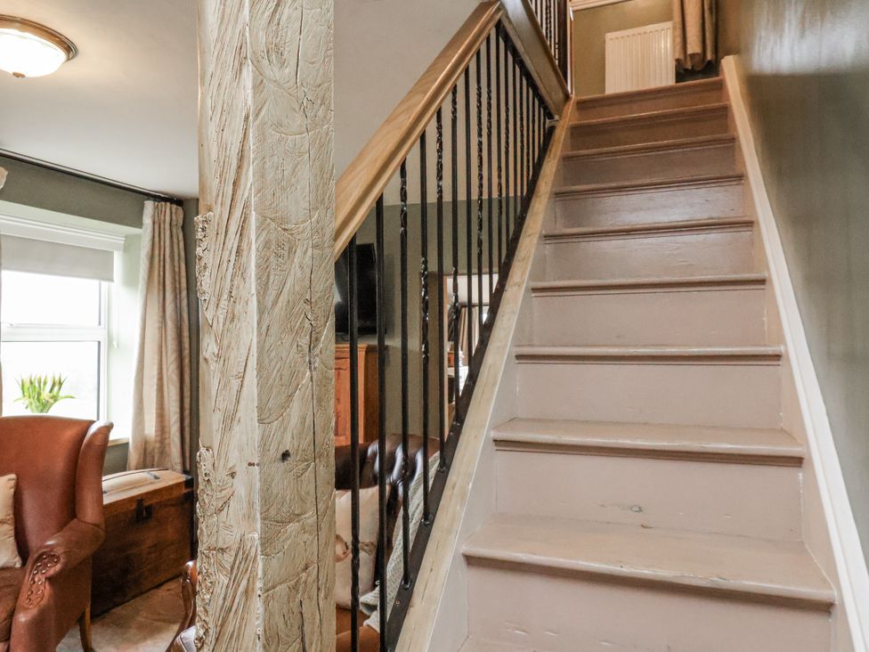 A staircase leading to the upper level at Ingleside Cottage Whitby