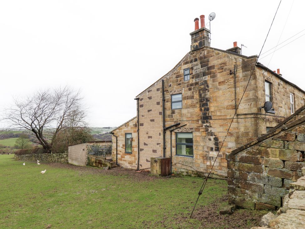 A house with windows and a garden at Ingleside Cottage Whitby