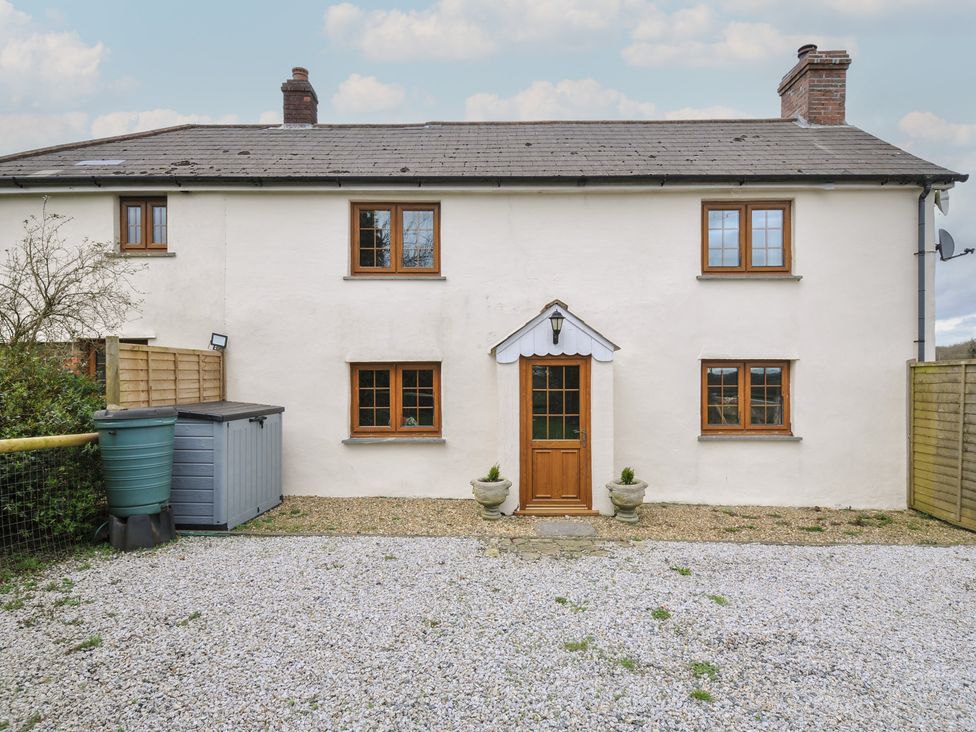 A house with a front door and windows at Little Blagdon in Ashwater