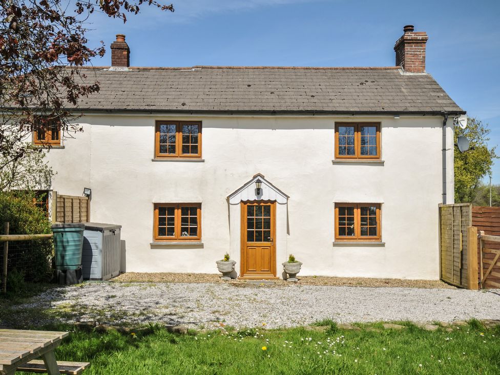 A house with a front door and windows at Little Blagdon in Ashwater
