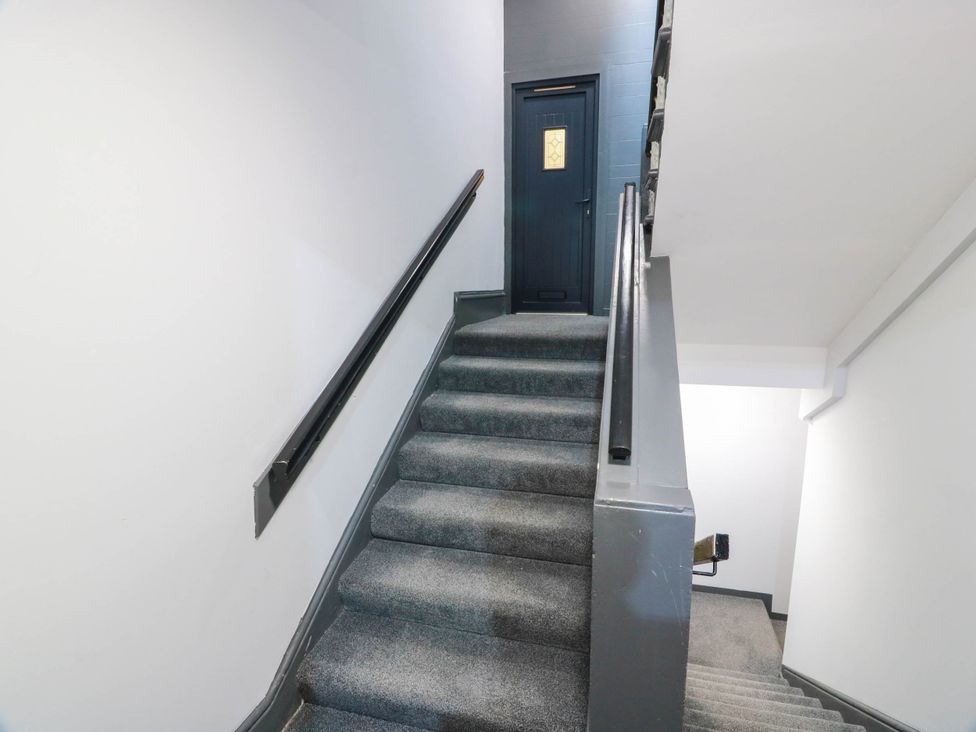 A staircase leading to a door at Flat 1 86 Gallowgate Street Largs