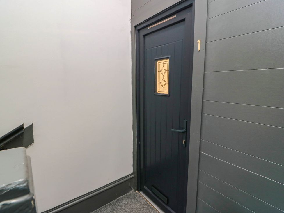 A doorway with a number 1 in a hallway at Flat 1 86 Gallowgate Street Largs