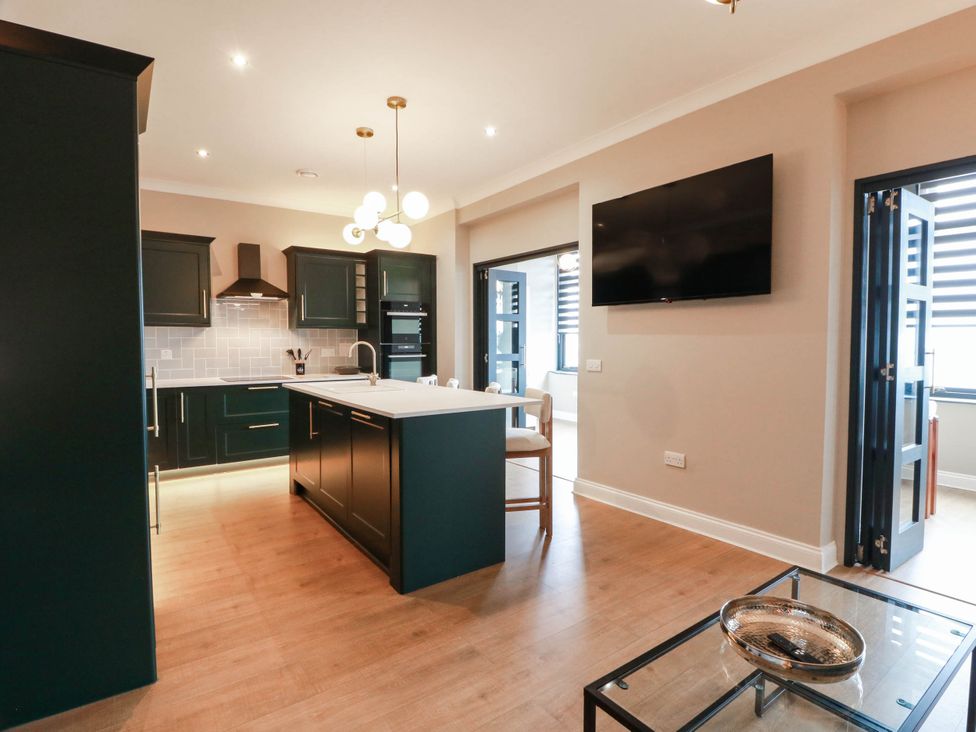 A kitchen with cabinets and appliances at Flat 1 86 Gallowgate Street in Largs