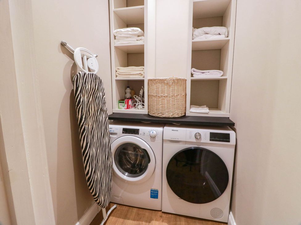 A laundry room with a washing machine and dryer at Flat 1 86 Gallowgate Street Largs