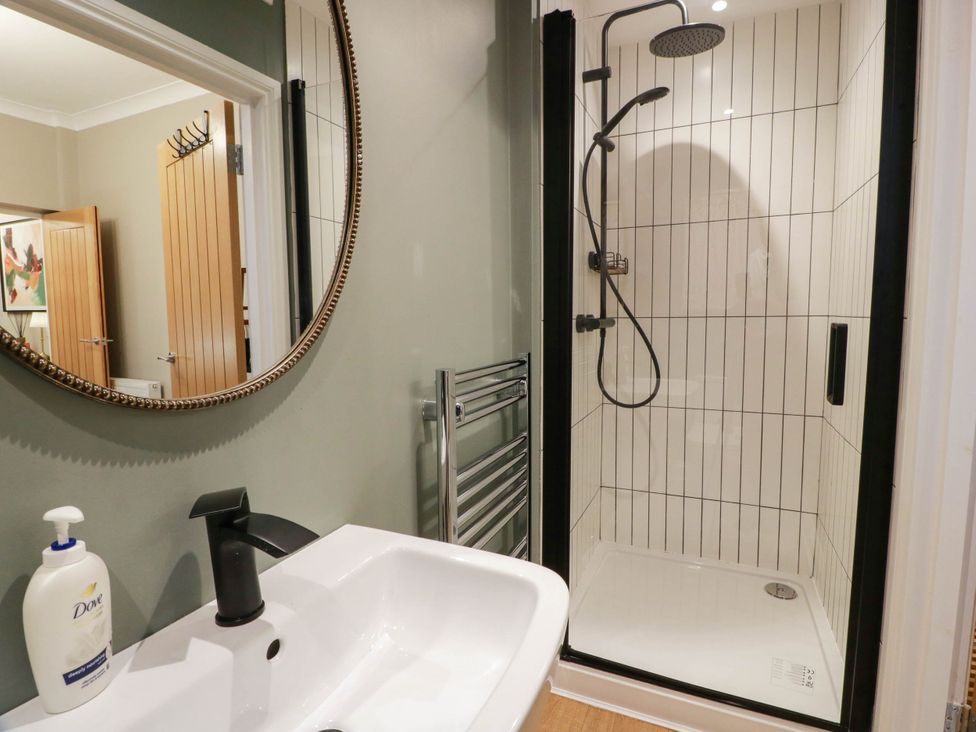 A bathroom with a shower and sink at Flat 1 86 Gallowgate Street Largs