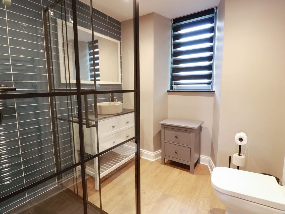 A bathroom with a shower, sink and toilet at Flat 1 86 Gallowgate Street Largs