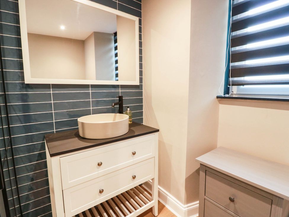 A bathroom with a sink and mirror at Flat 1 86 Gallowgate Street in Largs