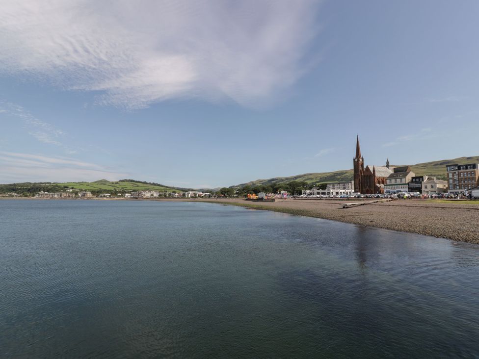 A view of buildings and a church by the water at Flat 1 86 Gallowgate Street Largs