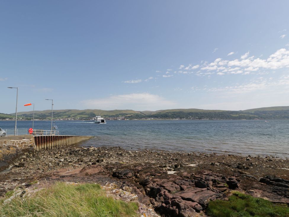 A view of a pier with water and hills in the background at Flat 1 86 Gallowgate Street Largs