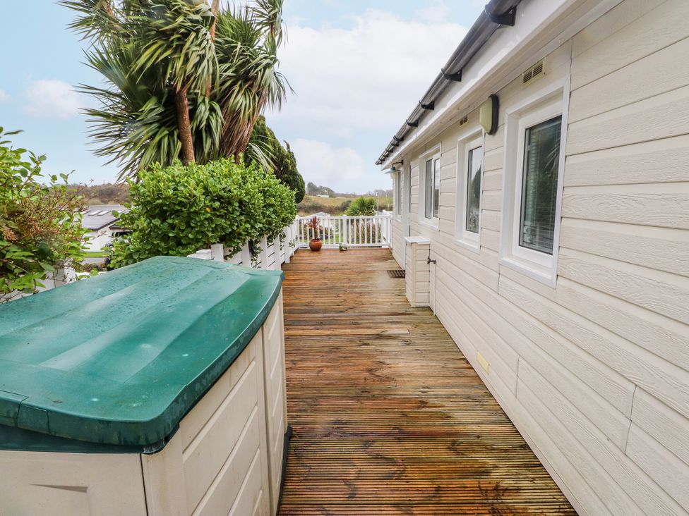 An outdoor area with decking and a shed at Lodge 134 near Bellech