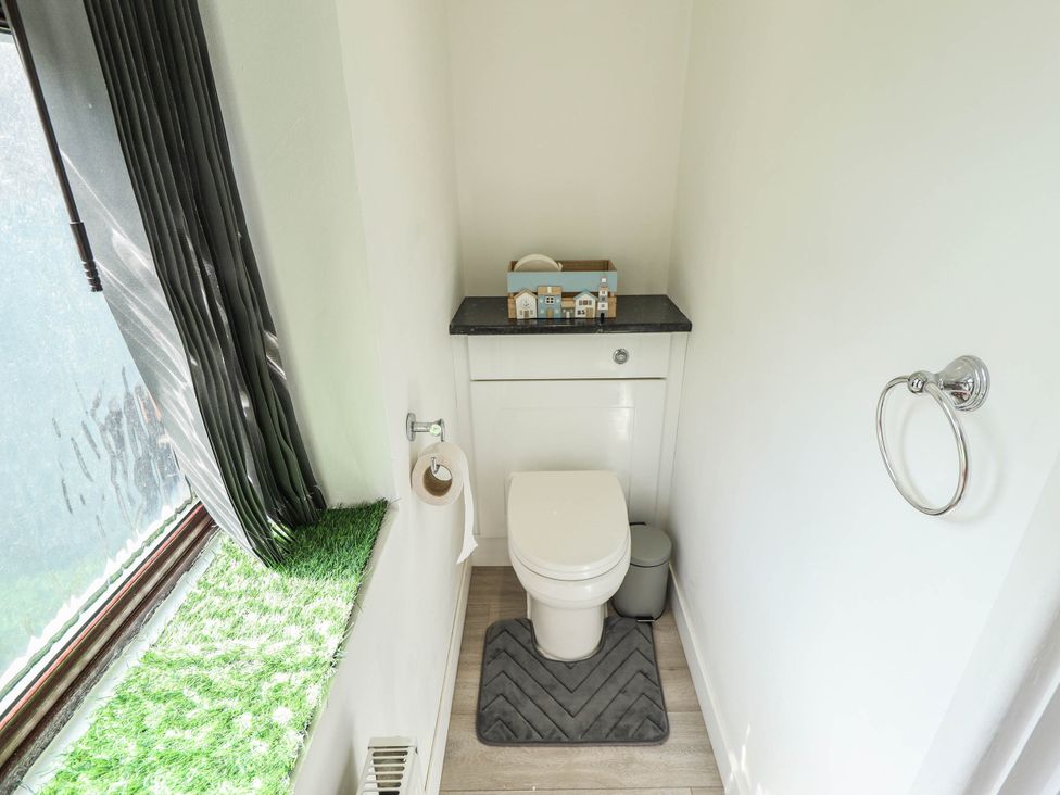 A bathroom with a toilet and sink at The Ocean House   --- Sea Whisper (Top Floor )  Le Strange Terrace in Hunstanton