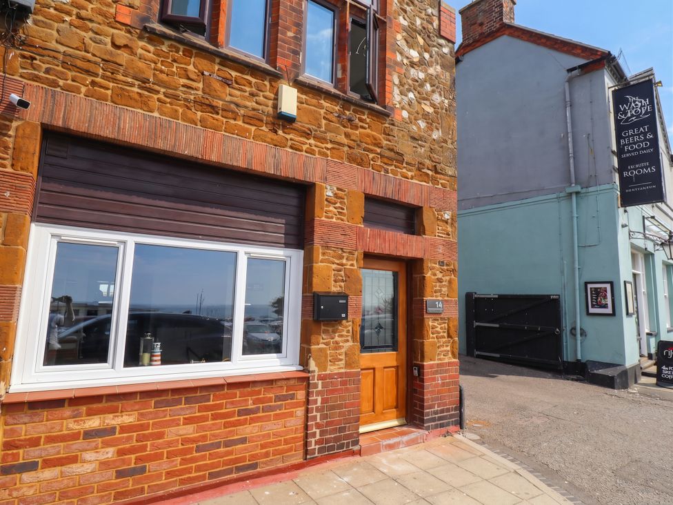 An exterior view of a building with a window and door at The Ocean House --- Sea Whisper (Top Floor ) Le Strange Terrace, Hunstanton