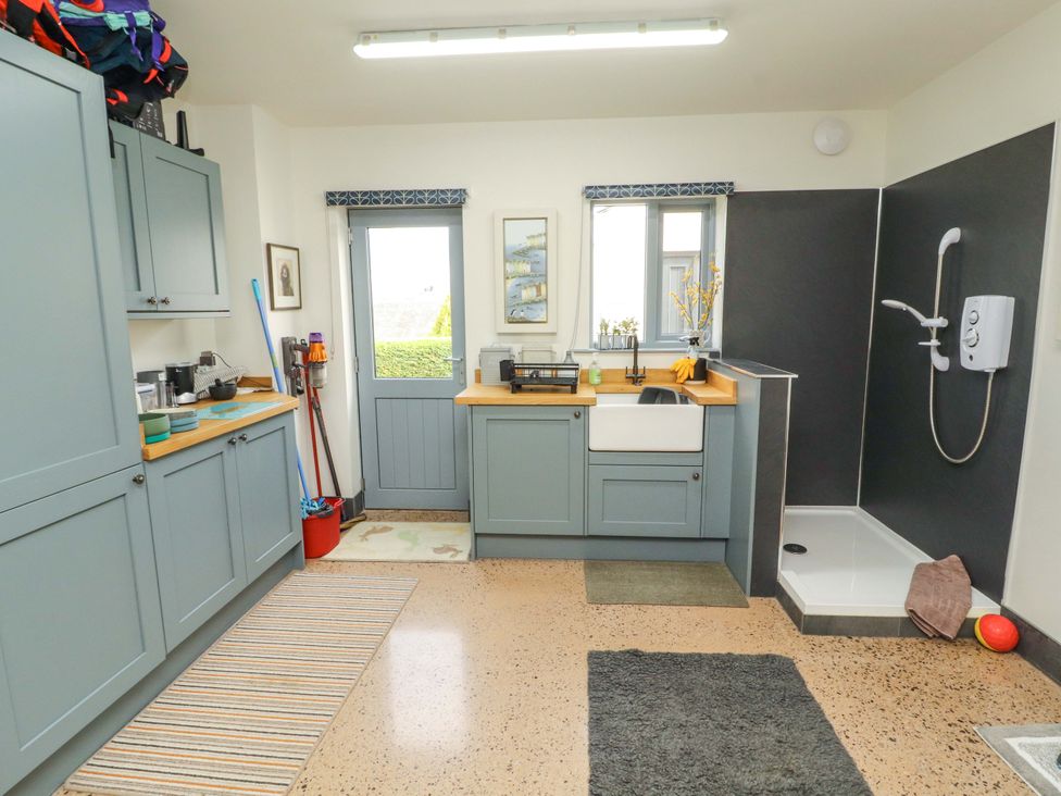 A kitchen with a sink and shower at Lakes View in Keswick
