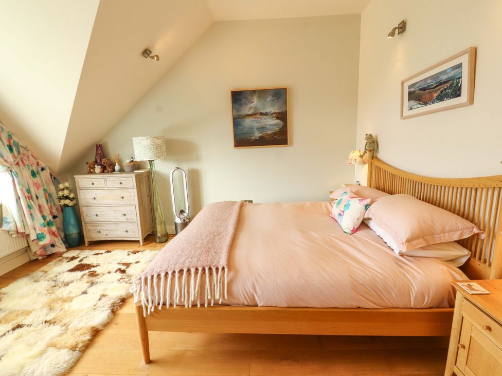 A bedroom with a bed and drawers at Lakes View in Keswick