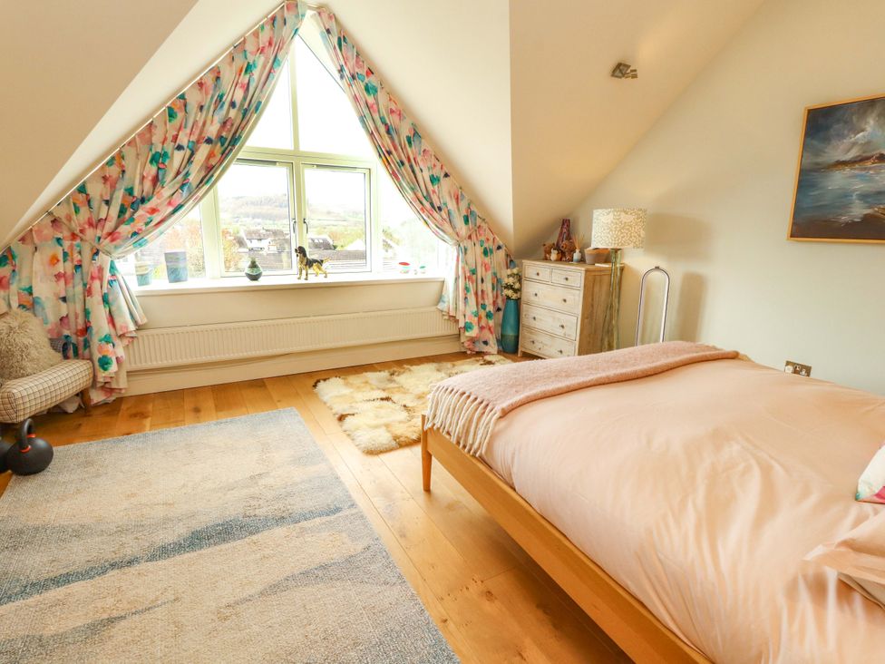 A bedroom with a bed and window at Lakes View in Keswick