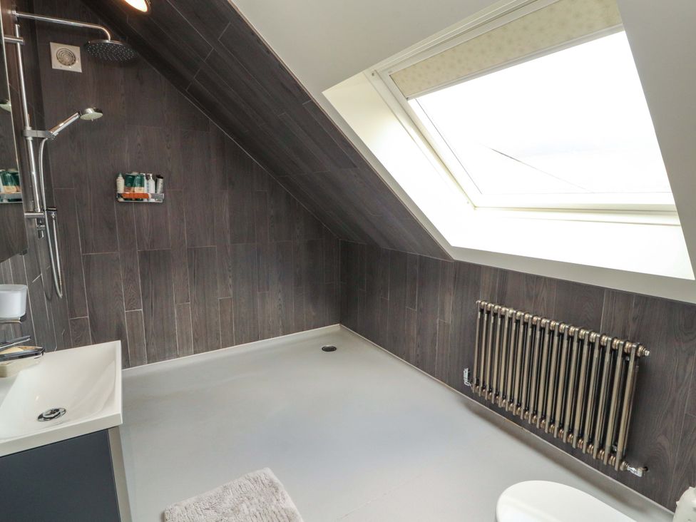 A bathroom with a shower and sink at Lakes View in Keswick