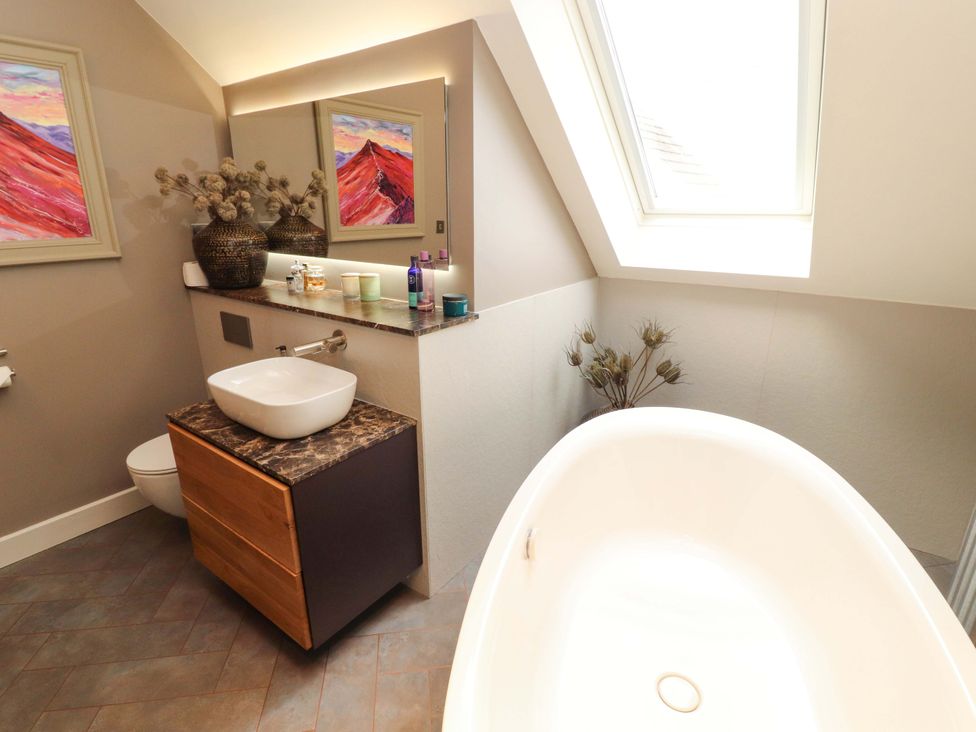 A bathroom featuring a bathtub, sink, and toilet at Lakes View in Keswick