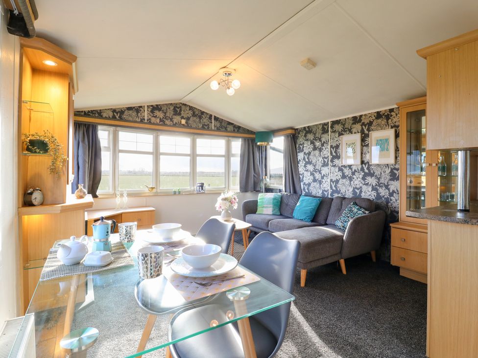 A dining room with a table set for meals at Granada at Avalon Eco Farm in Cambridge