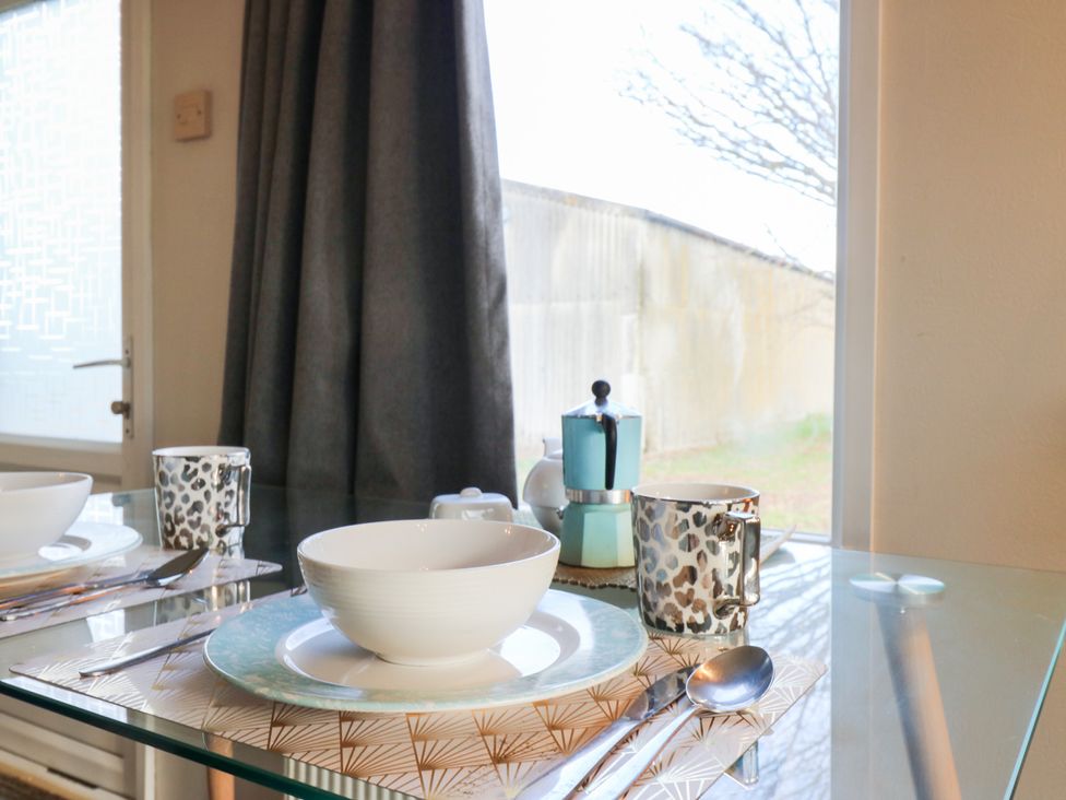 A dining table set with bowl and cup at Granada at Avalon Eco Farm in Cambridge
