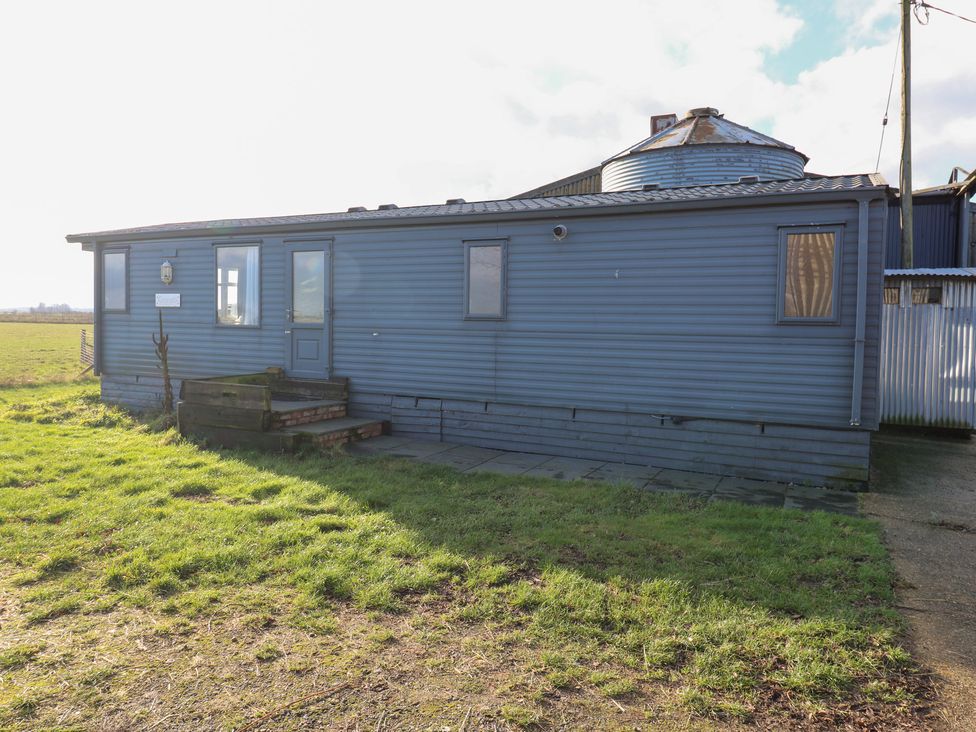 A house with steps leading to a door at Granada at Avalon Eco Farm Cambridge