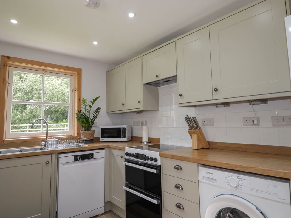 A kitchen with appliances and fixtures at Station Lodge near Forres