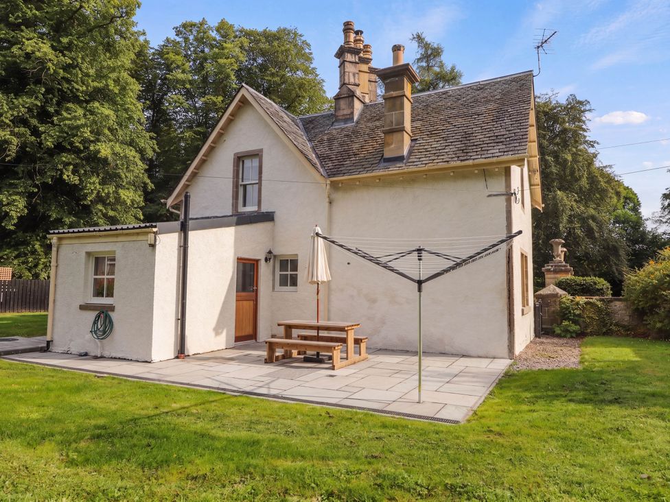 A house with a patio and table near Forres