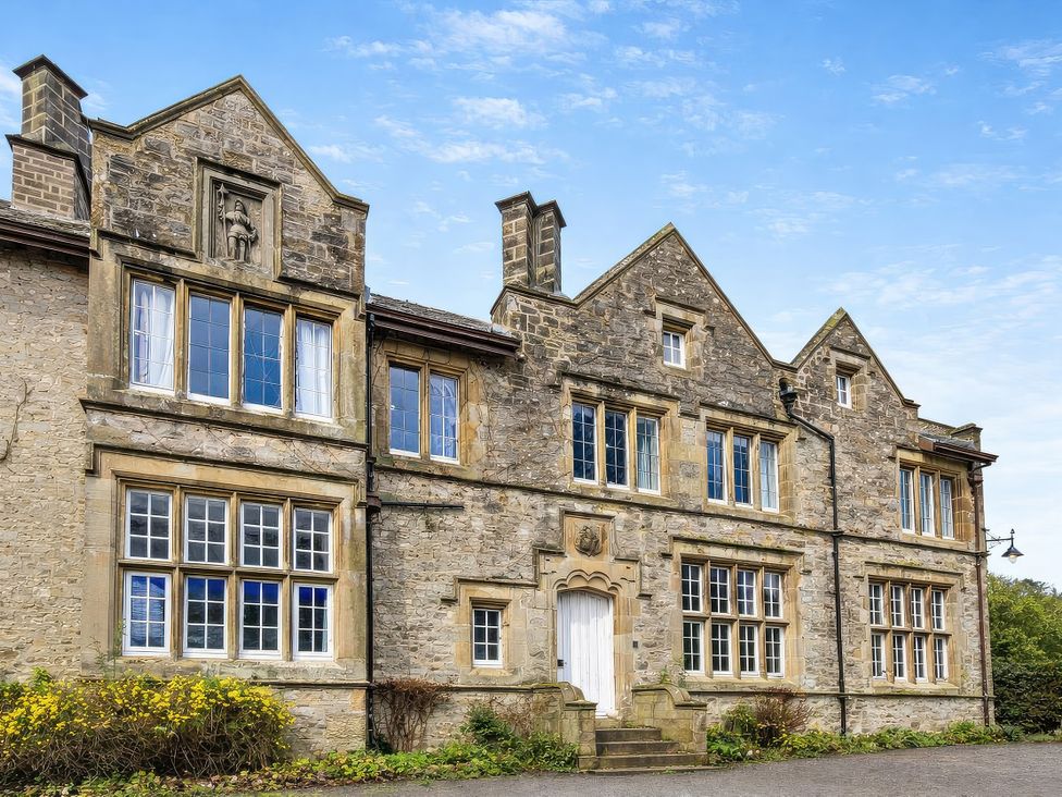 A building facade with windows and a door at Hanlith Hall near Malham