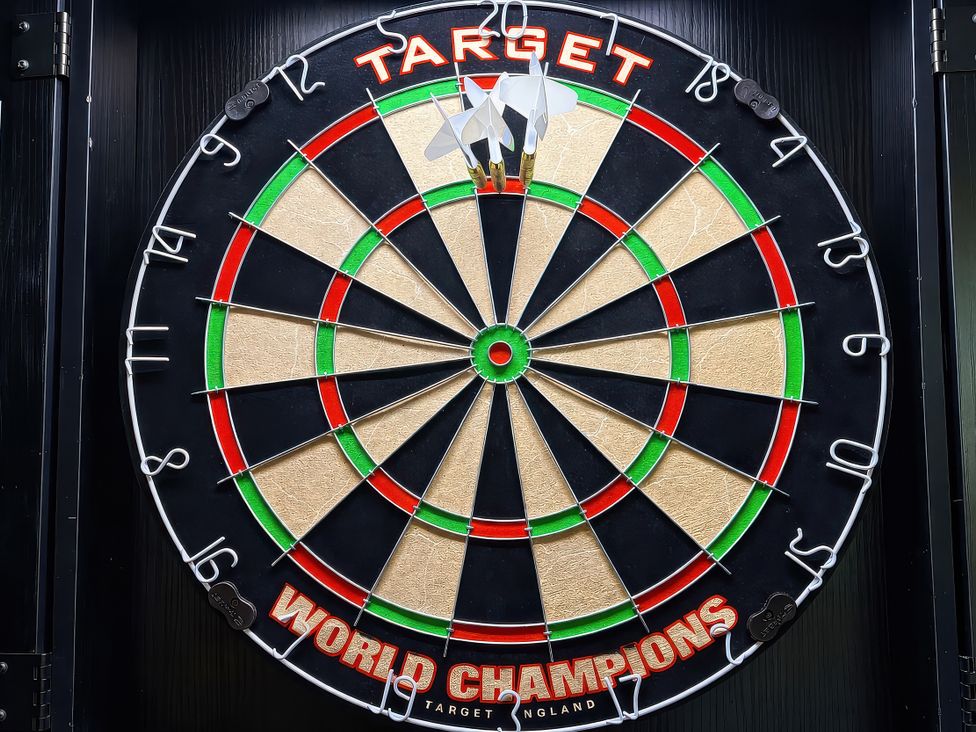 A dartboard with darts on it at Hanlith Hall in Hanlith near Malham