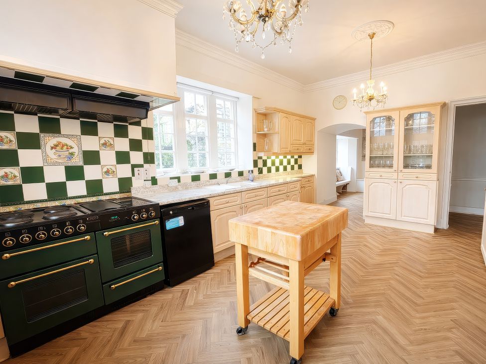 A kitchen with a stove and cabinets at Hanlith Hall near Malham