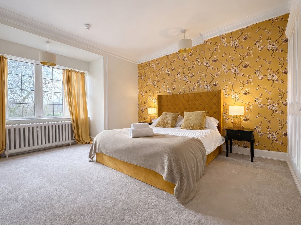 A bedroom with a bed and window at Hanlith Hall in Hanlith near Malham
