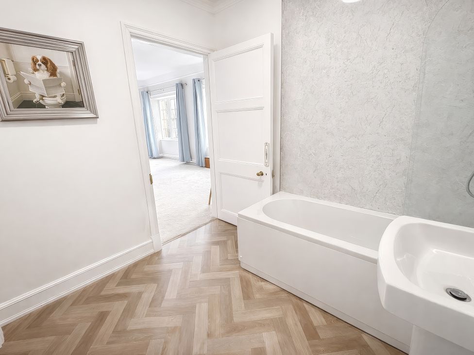 A bathroom with a bathtub and sink at Hanlith Hall Hanlith near Malham