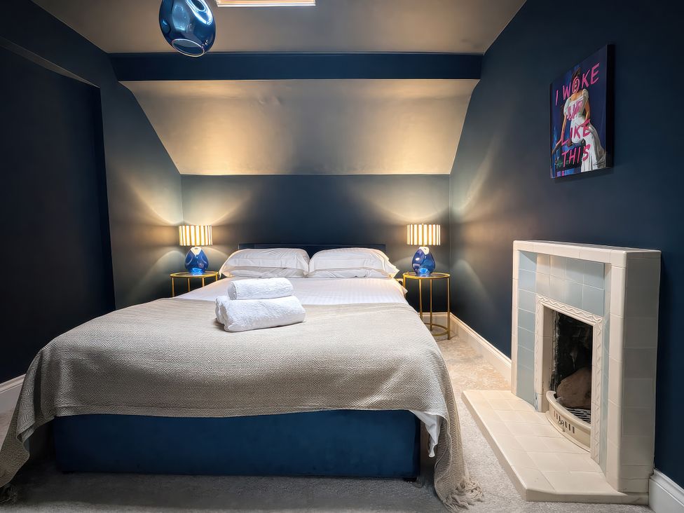 A bedroom with a bed and bedside lamps at Hanlith Hall in Hanlith near Malham