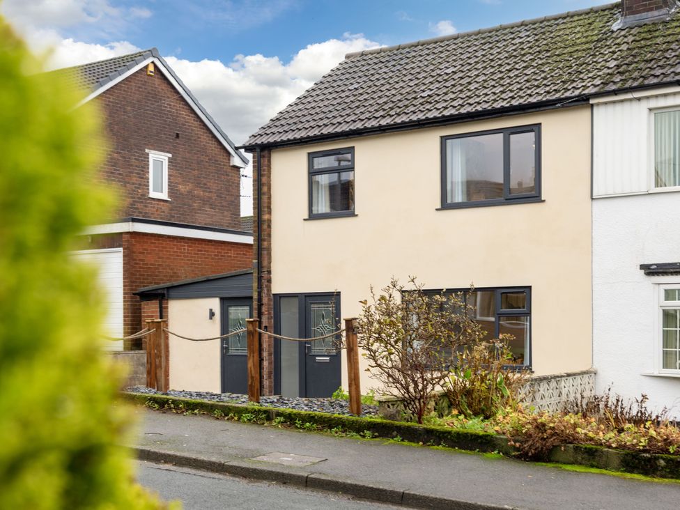 A house with windows and a front door at Thieveley Pike View Burnley