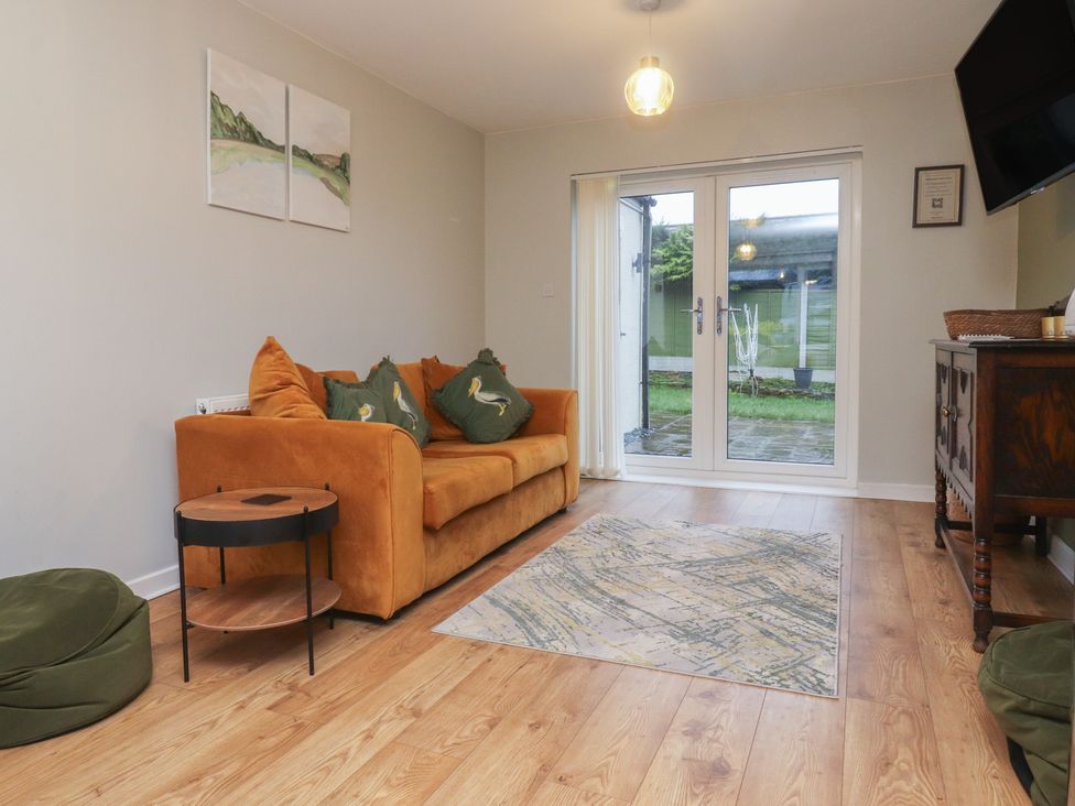 A living room with a sofa and a coffee table at Thieveley Pike View in Burnley