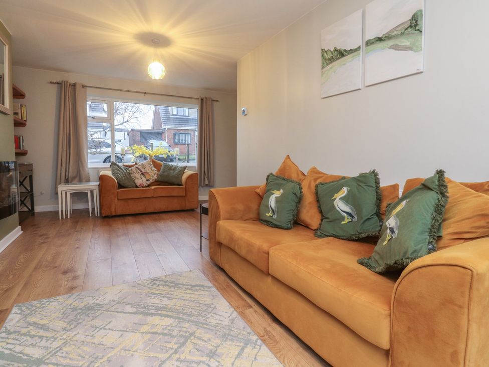 A living room with a sofa and coffee table at Thieveley Pike View Burnley