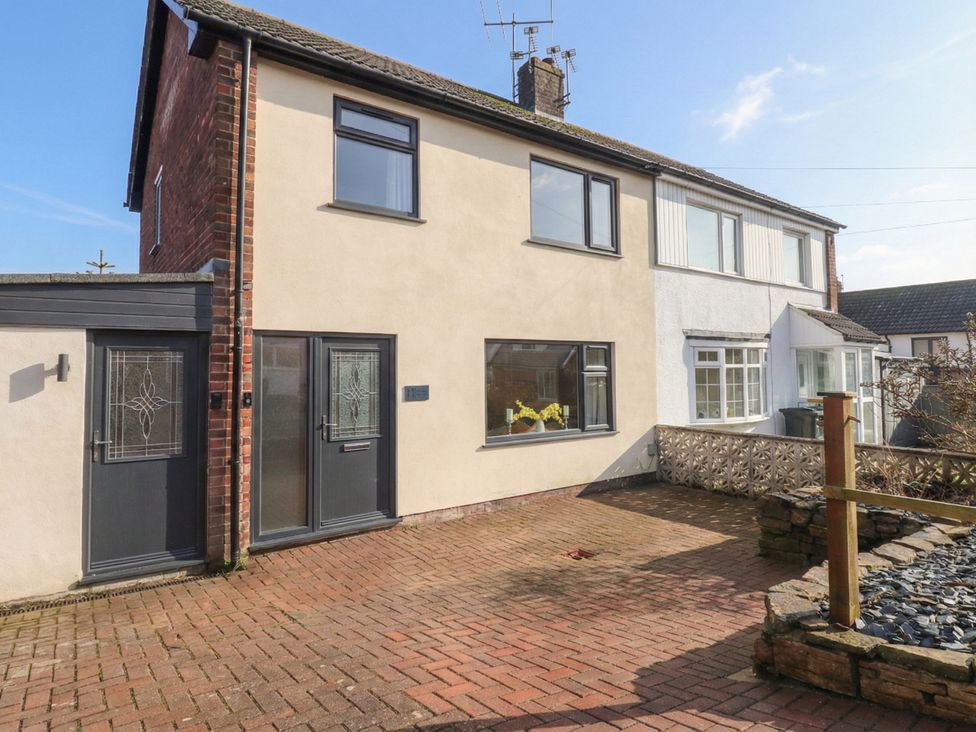 A house with a paved driveway and windows at Thieveley Pike View in Burnley